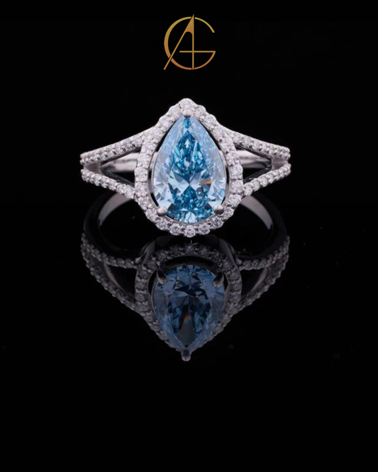 2.00 CT Gorgeous Fancy Vivid Blue Moissanite Pear Cut Ring with Halo Diamond Accents and Elegant Split Shank Band